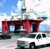 Photo taken by D. Cooper © Chevy and Oil Platform in inlet (TX)